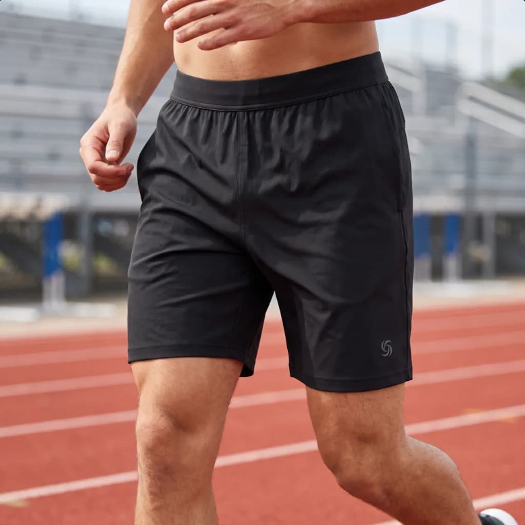 Stride and Soul gym ready stretch shorts worn on a running track