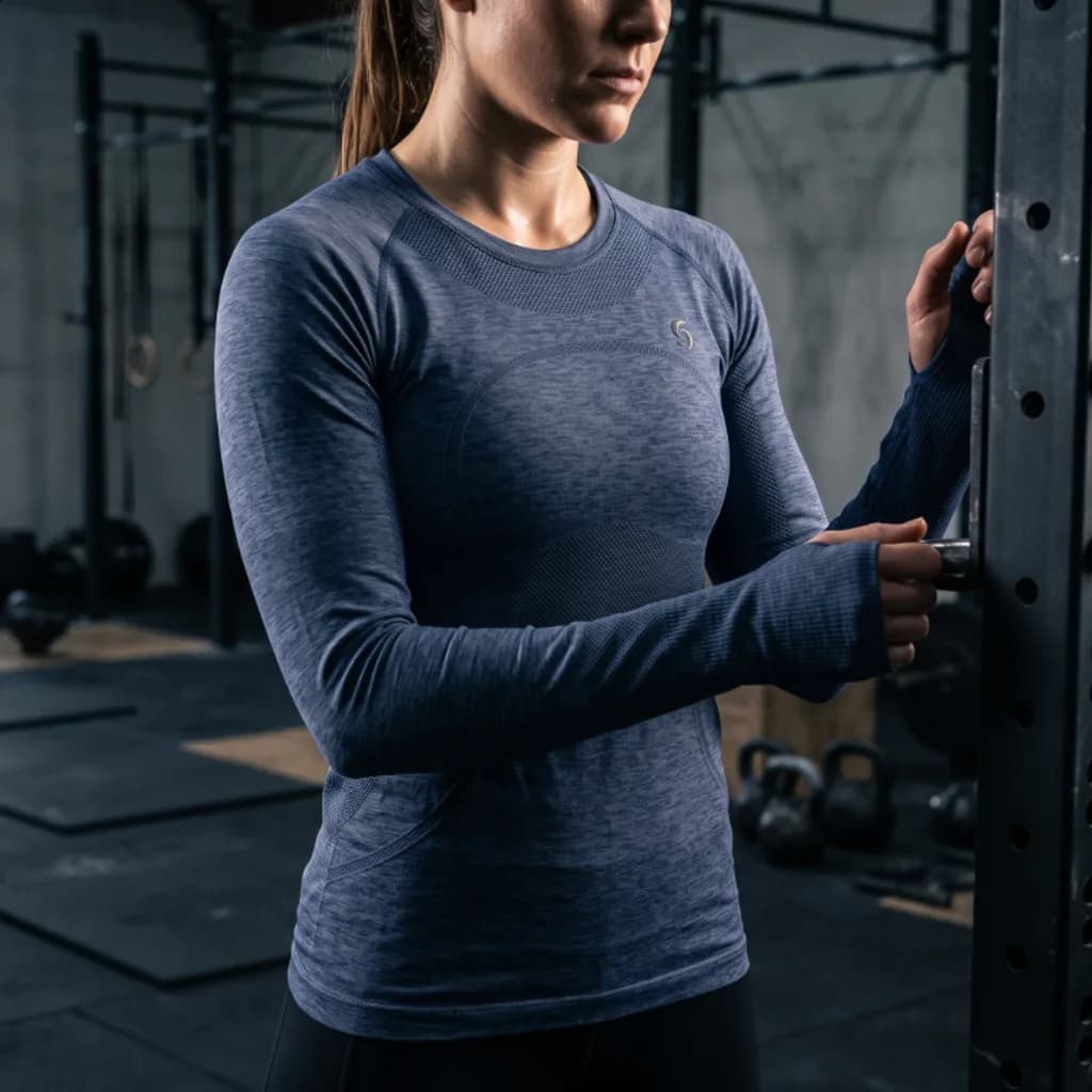 Stride and Soul seamless long sleeve top worn at a gym squat rack